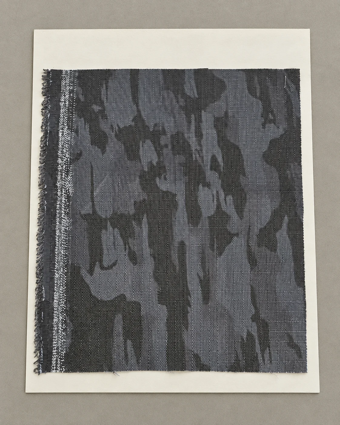 Grey camouflage fabric swatch