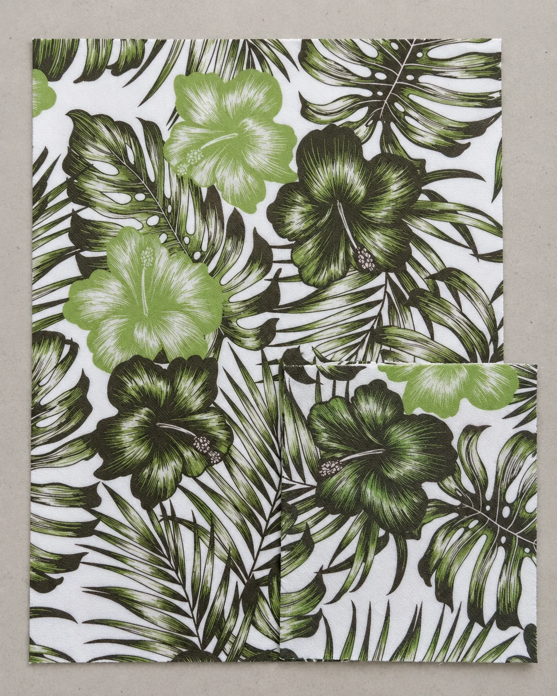 Green floral and leaf-pattern material samples